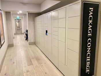 a set of white lockers in a hallway of a building